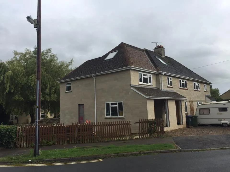 a house with a car parked in front of it