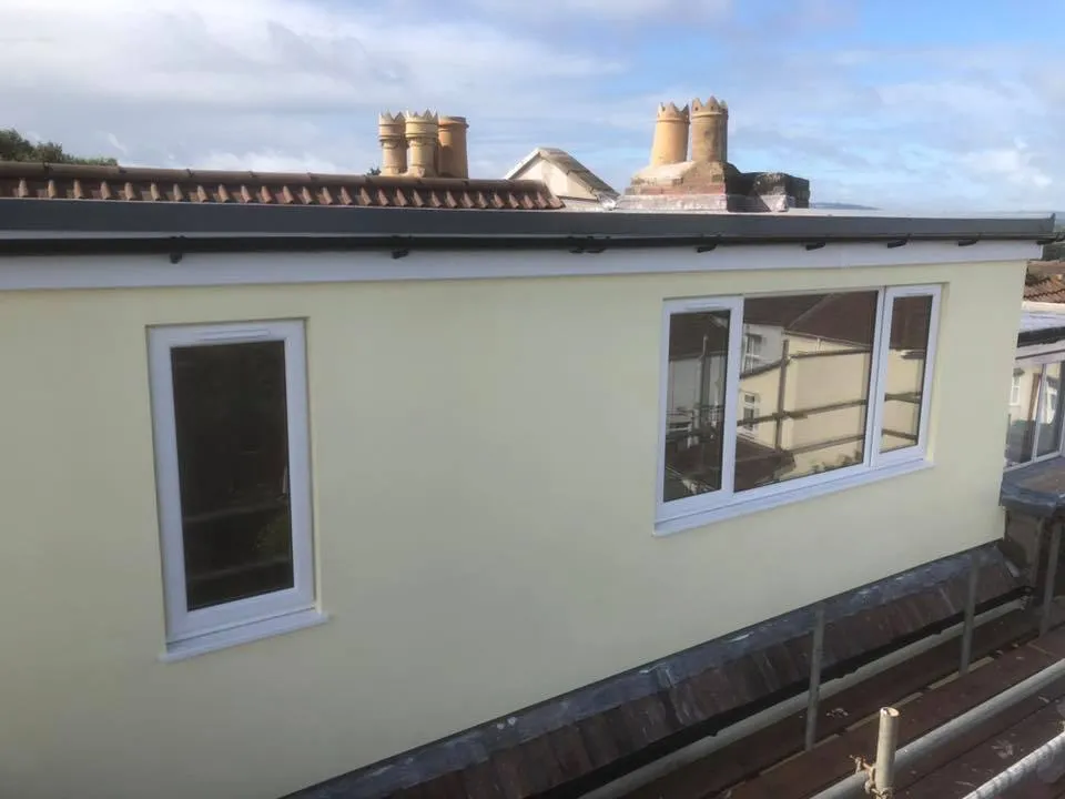 a house that is being built on the roof of a building