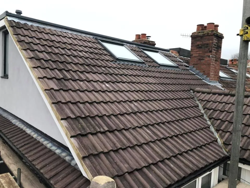 a house with a roof that has a lot of shingles on it